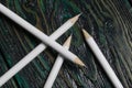 A set of white pencils for school. They lie on pine boards Royalty Free Stock Photo