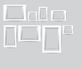 Set of white photo frames. Vector collection of blank photo frames on a gray background. Royalty Free Stock Photo