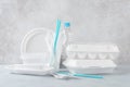 Set of white plastic disposable tableware and packaging Royalty Free Stock Photo