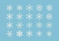 A set of 20 white snowflake designs on a light blue background. Each snowflake is uniquely patterned Royalty Free Stock Photo