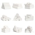 set of white spa towels stacked and in basket isolated on white background Royalty Free Stock Photo