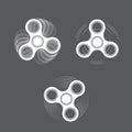 Set of white spinning fidget spinners on gray background