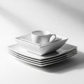 Stack of White Square Plates and a Cup on a White Surface with Soft Lighting ceramic porcelain Royalty Free Stock Photo