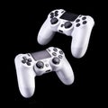 Set of white video game joysticks gamepad isolated on a black background Royalty Free Stock Photo