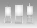 Set of White Wooden Easels with Blank Canvases