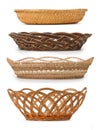 Set of wicker baskets, breadbaskets, bread-plates, dishes for food or fruits isolated on a white background. Low angle, side view Royalty Free Stock Photo