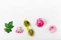 Set of wild pink roses ,leaves and yellow fashion sunglasses on white background. Top view, template. Copy space