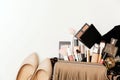 Set of woman`s cosmetics in a bag. Women`s secrets. Cosmetics, perfume, brushes, powder, highlighter, concealer,patelle with eye s Royalty Free Stock Photo