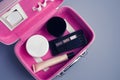 Set of woman`s cosmetics in a bag. Women`s secrets. Cosmetics, perfume, brushes, powder, highlighter, concealer,patelle Royalty Free Stock Photo