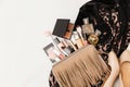 Set of woman`s cosmetics in a bag. Women`s secrets. Cosmetics, perfume, brushes, powder, highlighter, concealer,patelle with eye s Royalty Free Stock Photo