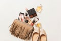 Set of woman`s cosmetics in a bag. Women`s secrets. Cosmetics, perfume, brushes, powder, highlighter, concealer,patelle with eye s Royalty Free Stock Photo