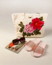 Makhachkala, Dagestan, RUS, July 13, 2019 Set of a women`s bag with embroidery in the form of flowers, sunglasses, a fashion