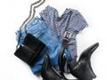 Set of women`s outfit - jeans, western boots, bag, belt and str