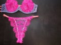 A set of women& x27;s underwear from panties bra and stockings belt in pink and blue Royalty Free Stock Photo