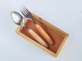 Set of wood foodware in box background Royalty Free Stock Photo