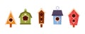 Set of Wooden Bird Houses, Colorful Feeders, Sweet Homes for Birds of Different Design with Slope Roof. Birdhouses, Nest Royalty Free Stock Photo