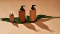 Set of wooden bottles or containers of different sizes on green leaf isolated on beige background. Zero waste and eco