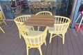 Set of wooden chair and table with four side sitting arrangement hotel outdoor