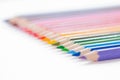 Set of wooden colored pencils- crayons on a white paper Royalty Free Stock Photo