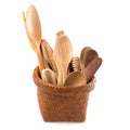 Set of wooden cutlery in Wicker baskets isolated on a white back Royalty Free Stock Photo