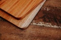 set of wooden cuttng boads on wooden background. Wooden kitchen block close up