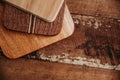 set of wooden cuttng boads on wooden background. Wooden kitchen block close up