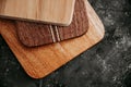 set of wooden cuttng boads on black background. Wooden kitchen block close up