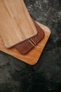 set of wooden cuttng boads on black background. Wooden kitchen block close up