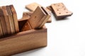 Set of wooden dominoes in box on white table, closeup Royalty Free Stock Photo