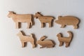 Set of wooden farm animals handmade. Waldorf toys on white background