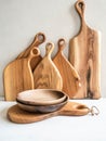 Set of wooden kitchenware - cutting board and bowls. copy space Royalty Free Stock Photo