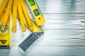 Set of wooden meter construction level try square on white board Royalty Free Stock Photo