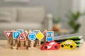 Set of wooden road signs and cars on table indoors, closeup. Children\'s toys Royalty Free Stock Photo