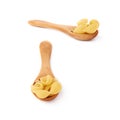 Set of wooden spoon filled with dry conchiglie pasta over isolated white background Royalty Free Stock Photo