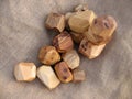 A set of wooden stones for tumi ishi toy on a sackcloth