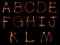 Set of word writing from light on the black background.