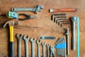 Set of work tools on old grunge wood background Royalty Free Stock Photo