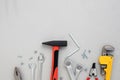 A set of working tools, a hammer, a screwdriver, adjustable spanner, sockets for repair on a gray concrete background Royalty Free Stock Photo