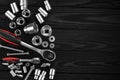 Set of wrenches, bolts and nuts on a wooden background. Royalty Free Stock Photo