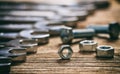 Set of wrenches bolts and nuts on wooden background Royalty Free Stock Photo