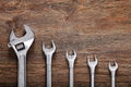 Set of wrenches tiered on wooden table background Royalty Free Stock Photo