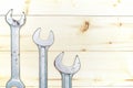 Set of wrenches on wooden background with copy space. Royalty Free Stock Photo