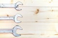 Set of wrenches on wooden background with copy space. Royalty Free Stock Photo