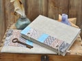 Set the writer for creativity and handmade: a notebook turquoise craft patchwork, textile pencil case, vintage feather Royalty Free Stock Photo