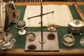 A set of written antique accessories and a scales on an old writing desk Royalty Free Stock Photo