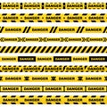 Set of yellow ribbons with black lettering danger skull and stripes indicating dangerous place on a white background. Safety polic