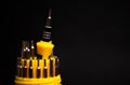 a set of yellow screwdrivers on a black background