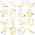 Set of yellow stethoscopes on white background. Medical device Royalty Free Stock Photo