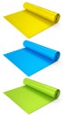 Set of yoga mats or lightweight foam camping bed roll pad isolated on white.