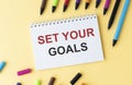 Set your goals words written on lined paper Royalty Free Stock Photo